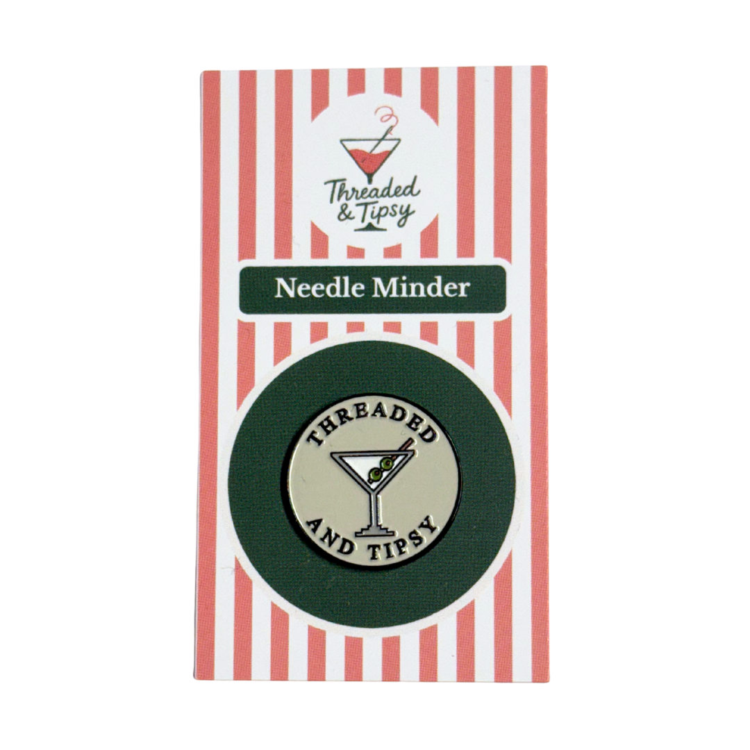 Threaded & Tipsy Needle Minder packaging with red and white striped background