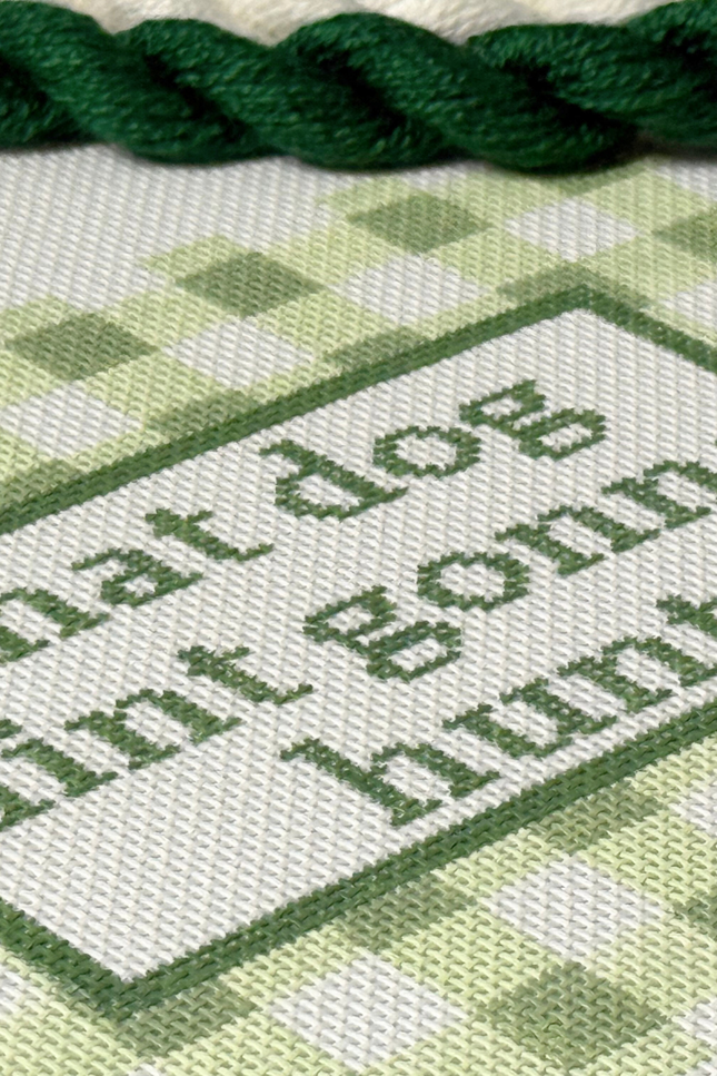 Needlepoint text on Needlepoint Canvas with green thread