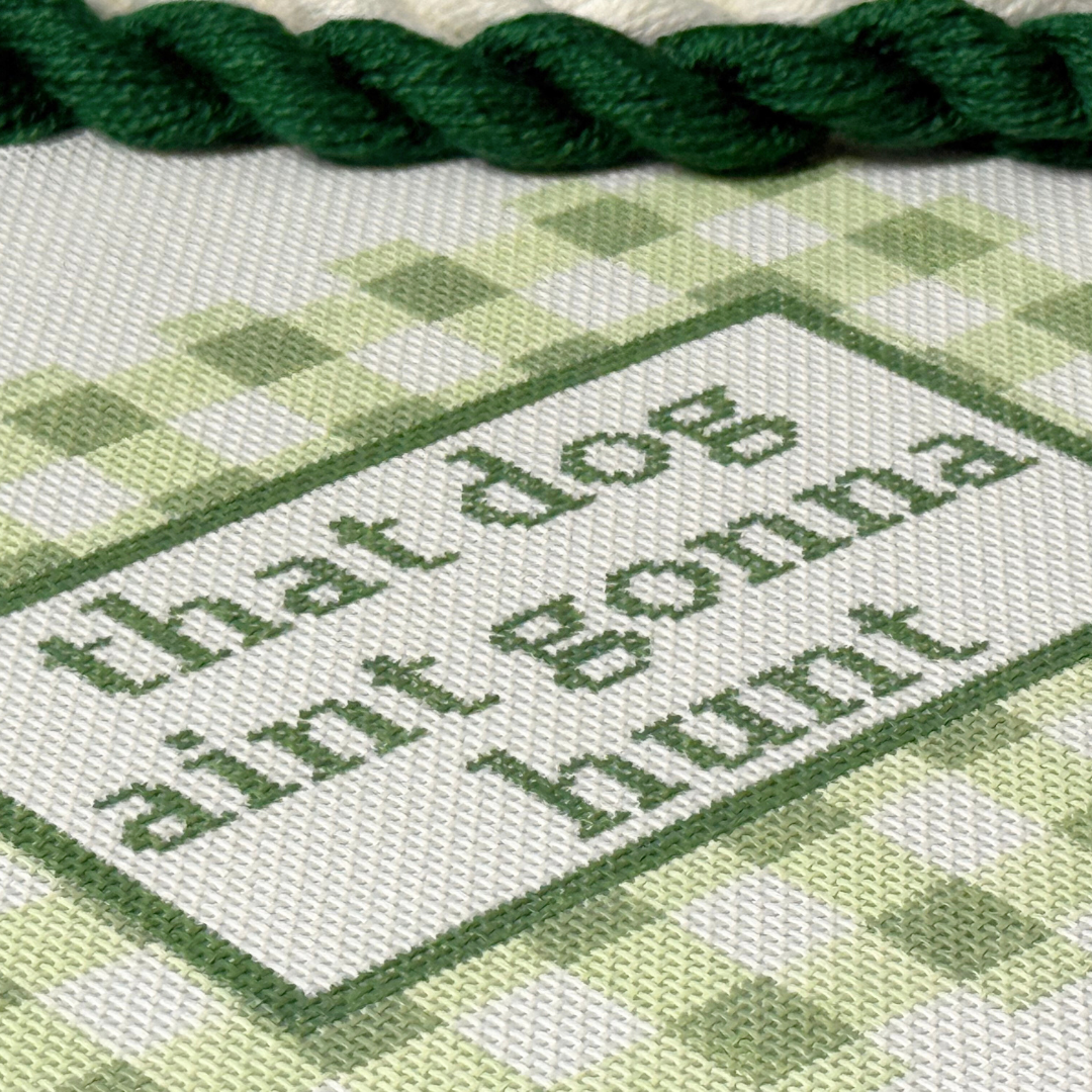 Needlepoint text on Needlepoint Canvas with green thread