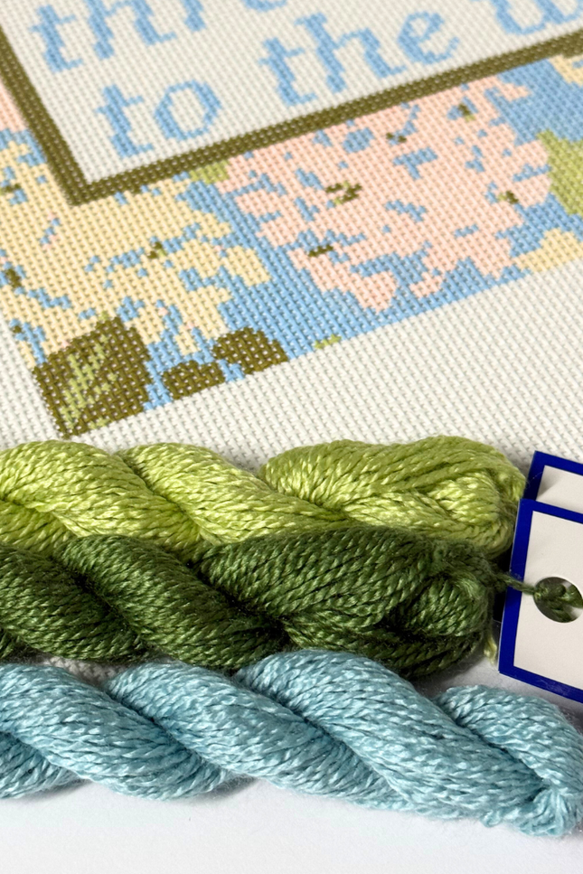 Needlepoint Kit with green and blue yarn, featuring a label for 'Milan by Tilli Tomas'.