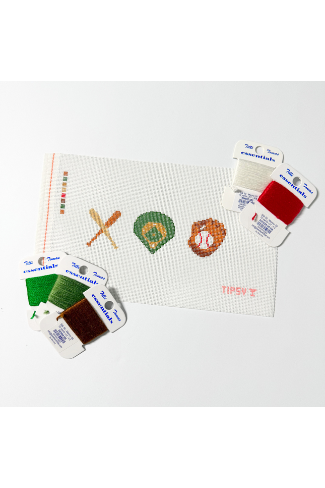 Needlepoint Kit project with sports-themed designs and color swatches on a white background