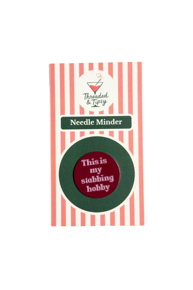 Needle Minder with humorous text on striped packaging that says Threaded and Tipsy