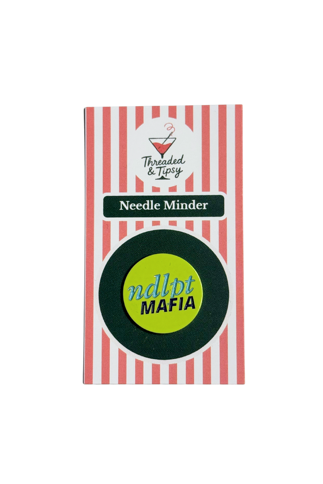 Needle Minder with striped packaging on a white background