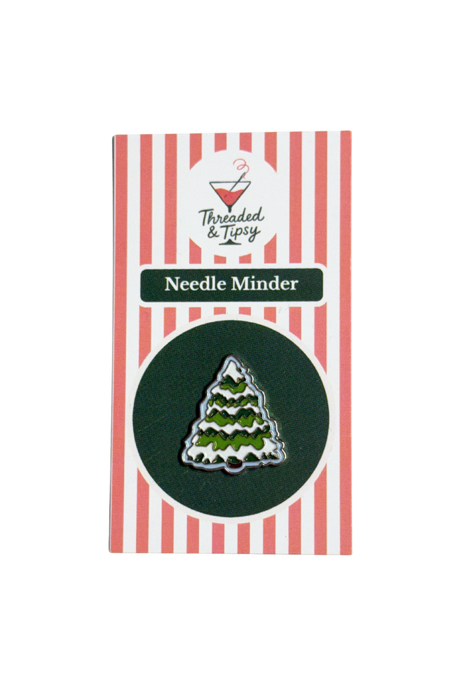 Needle Minder with Christmas tree design on striped packaging