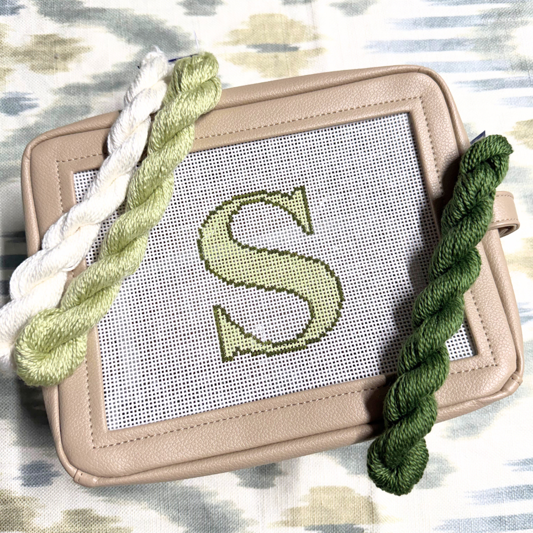 needlepoint kit with a completed letter &