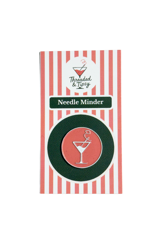 Needle Minder with striped packaging on a white background